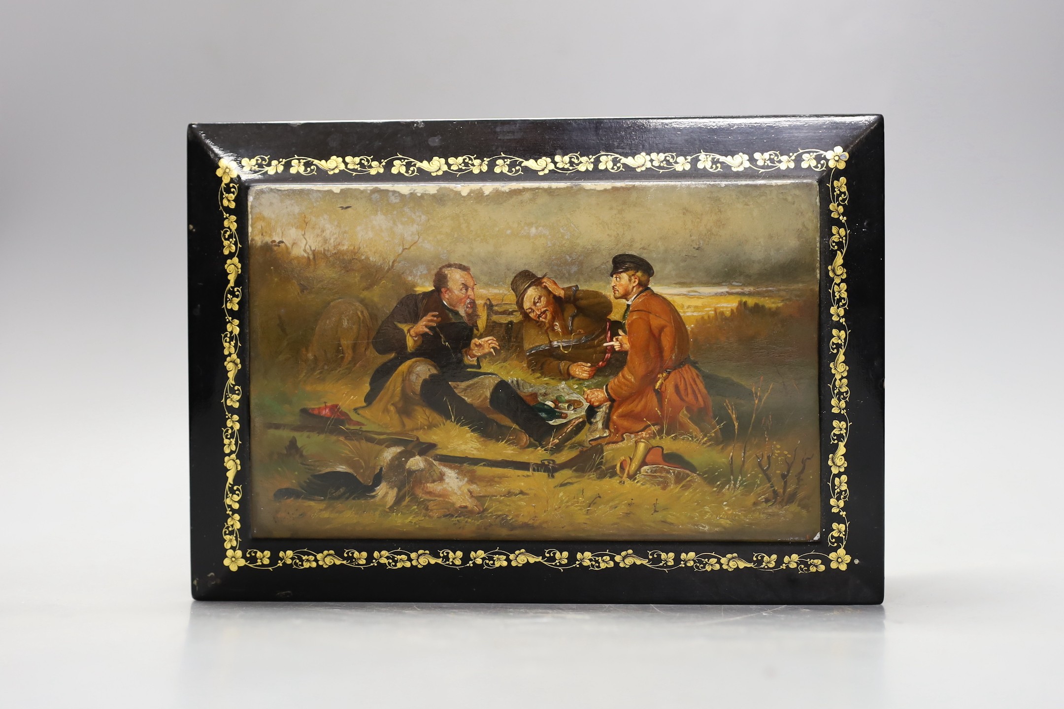 A Russian painted and ebonised box, 23cms wide